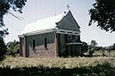 Uściług, 1998 r. Kaplica z 1810 roku na zdewastowanym cmentarzu rzymskokatolickim, odnowiona i obecnie czynna.